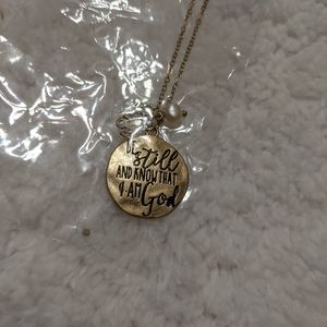 Worn Goldtone 'Be Still' Necklace and Earrings